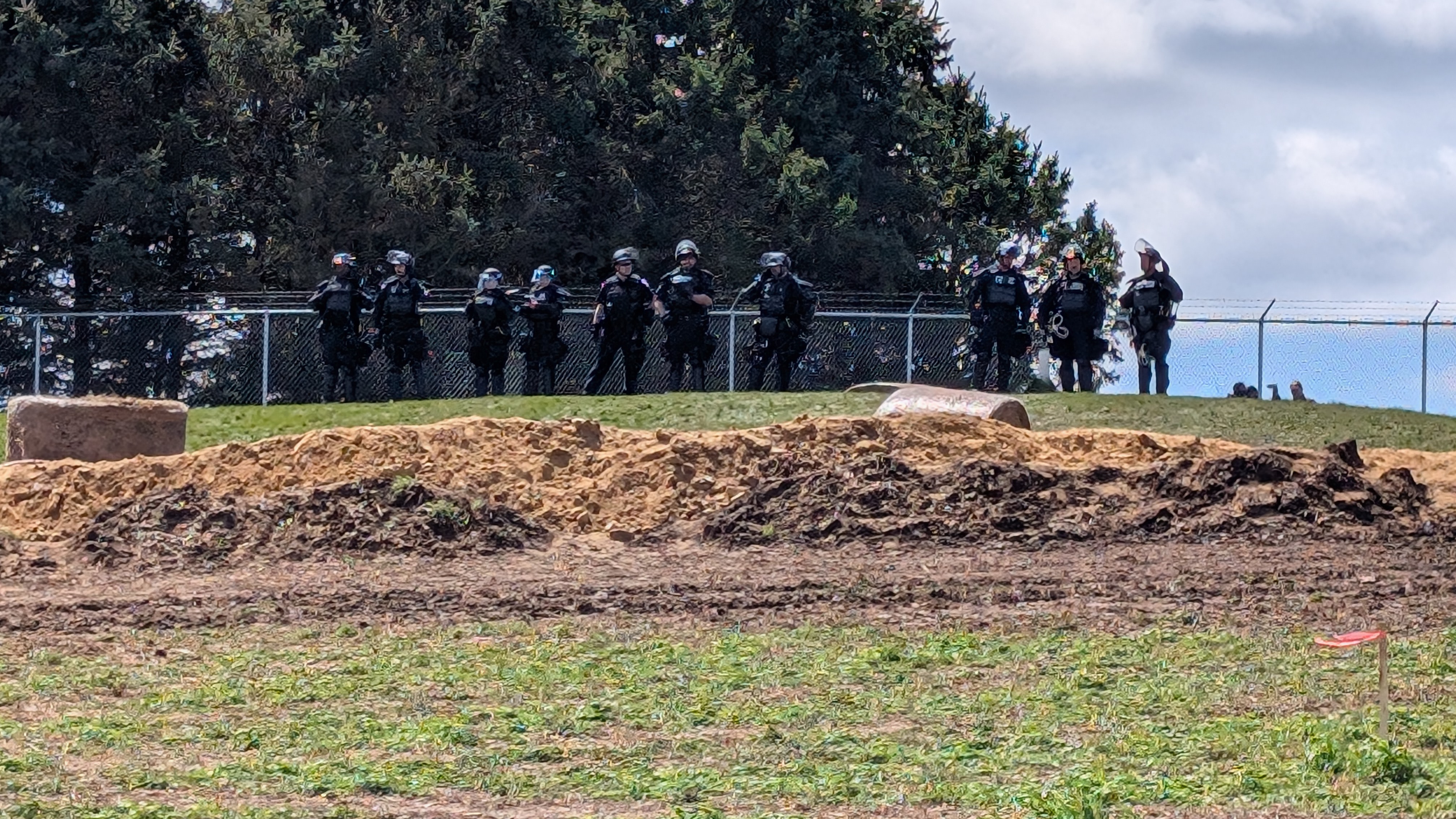 Riot police on the perimeter.